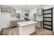 Modern kitchen with stainless steel appliances, island, and ample cabinet space at 308 Birch St, Lowell, NC 28098