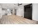 Open-concept living space featuring updated kitchen, modern flooring, and contemporary accents at 308 Birch St, Lowell, NC 28098