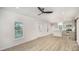Open living area with lots of natural light showcasing the kitchen and front door at 308 Birch St, Lowell, NC 28098