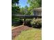 A spacious deck with decorative railing overlooks the lush backyard and provides a covered patio at 311 33Rd Street Se Dr, Hickory, NC 28602