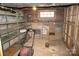 Storage area with brick walls, shelving, and storage containers offering ample space at 311 33Rd Street Se Dr, Hickory, NC 28602
