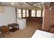Basement with a washer, dryer, tables and brick walls with multiple windows for natural light at 311 33Rd Street Se Dr, Hickory, NC 28602