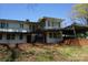 Unique two-story home with a distinctive layout, metal railings, and lush lawn at 311 33Rd Street Se Dr, Hickory, NC 28602