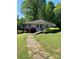 Charming single-story home with landscaped front yard and concrete walkway to the front entrance at 311 33Rd Street Se Dr, Hickory, NC 28602