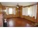 Spacious living room with paneled walls and natural light shining through multiple windows at 311 33Rd Street Se Dr, Hickory, NC 28602