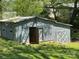 Charming gray outbuilding with barn doors, perfect for storage or workshop at 311 33Rd Street Se Dr, Hickory, NC 28602