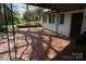 Brick patio area with decorative railings and access to the house and backyard at 311 33Rd Street Se Dr, Hickory, NC 28602