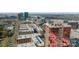An elegant high-rise featuring reflective glass architecture is nestled in an urban landscape at 315 Arlington Ave # 705, Charlotte, NC 28203