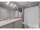 Elegant bathroom featuring granite countertops, modern fixtures, and a shower-tub combination at 315 Arlington Ave # 705, Charlotte, NC 28203