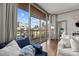 Bright living room with hardwood floors and large windows offering city views at 315 Arlington Ave # 705, Charlotte, NC 28203