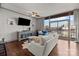Spacious living room with hardwood floors, lots of natural light, ceiling fan and modern furniture at 315 Arlington Ave # 705, Charlotte, NC 28203