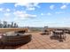 Relax in the comfortable seating with skyline views on this community rooftop deck at 315 Arlington Ave # 705, Charlotte, NC 28203