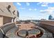 Enjoy this rooftop deck with modern seating and great skyline views at 315 Arlington Ave # 705, Charlotte, NC 28203