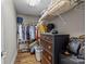 Spacious walk-in closet with custom shelving, ample storage space, and hardwood floors at 315 Arlington Ave # 705, Charlotte, NC 28203