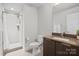 Modern bathroom featuring a tiled shower, floating vanity, and neutral decor at 324 Uptown West Dr, Charlotte, NC 28208