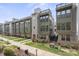 Exterior of contemporary townhouses, highlighting architectural details and well-maintained landscaping at 324 Uptown West Dr, Charlotte, NC 28208