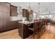 Stylish kitchen features stainless steel appliances, custom cabinetry, spacious island with seating and pendant lighting at 324 Uptown West Dr, Charlotte, NC 28208