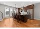 Spacious kitchen featuring wood cabinets, stainless steel appliances, and center island at 324 Uptown West Dr, Charlotte, NC 28208
