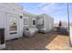 Outdoor rooftop deck featuring string lights, patio furniture, and brick pavers at 324 Uptown West Dr, Charlotte, NC 28208