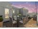 Virtually staged rooftop deck showing patio table, chairs, and string lights at 324 Uptown West Dr, Charlotte, NC 28208