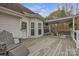 Covered outdoor deck with table, bench, and chair, great for entertaining or relaxing at 3565 Laboratory Rd, Lincolnton, NC 28092