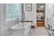 Stylish bathroom with a freestanding tub, frameless glass shower, and views into the Primary bedroom at 3565 Laboratory Rd, Lincolnton, NC 28092