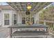 Covered deck with a ceiling fan, a view to the outdoor space, and plenty of room for furniture at 3565 Laboratory Rd, Lincolnton, NC 28092