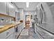 Well-lit kitchen boasts butcher block countertops, stainless steel appliances, and decorative backsplash at 3565 Laboratory Rd, Lincolnton, NC 28092