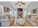 Spacious living room features a brick fireplace, hardwood floors, and lots of seating for guests at 3565 Laboratory Rd, Lincolnton, NC 28092