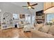 Inviting living room with vaulted ceiling, brick fireplace, hardwood flooring, and stylish furnishings at 3565 Laboratory Rd, Lincolnton, NC 28092