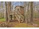 Exterior of tree house with wooden siding, stairs, and surrounded by trees at 3565 Laboratory Rd, Lincolnton, NC 28092