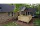 Expansive brick home featuring a new wood deck, brick accents and a screened in porch, perfect for outdoor enjoyment at 413 Parallel Dr, Harrisburg, NC 28075