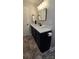 Bathroom features a sleek vanity with modern fixtures and a stylish mirror at 413 Parallel Dr, Harrisburg, NC 28075