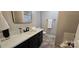 Bathroom features a modern vanity with updated fixtures at 413 Parallel Dr, Harrisburg, NC 28075