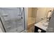 Bathroom featuring a glass enclosed shower, and a combined bathtub and shower at 413 Parallel Dr, Harrisburg, NC 28075