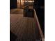 Evening shot of a backyard wood deck with wood railing, perfect for outdoor entertaining or relaxation at 413 Parallel Dr, Harrisburg, NC 28075