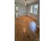 Dining room featuring hardwood floors, windows, and natural light at 413 Parallel Dr, Harrisburg, NC 28075