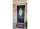 Elegant black front door with decorative glass insert and 'Hello' door mat at 413 Parallel Dr, Harrisburg, NC 28075