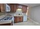 Spacious kitchen features tile backsplash, updated appliances, and ample counter space at 413 Parallel Dr, Harrisburg, NC 28075