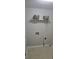 Laundry room includes tile floors, shelf, and washer/dryer hookups at 413 Parallel Dr, Harrisburg, NC 28075