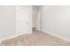 Bedroom featuring neutral carpet, white walls, and multiple doors leading to other rooms at 4141 Polluck Way, Charlotte, NC 28209