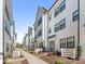 Row of modern townhouses with white siding, black trim, and landscaped walkways at 4141 Polluck Way, Charlotte, NC 28209