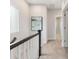 Bright hallway with neutral paint, plush carpet, and a view into adjacent rooms, creating a welcoming transition space at 4141 Polluck Way, Charlotte, NC 28209
