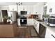Modern kitchen with stainless appliances, white cabinets, updated countertops, and wood-look floors at 436 Old Nc 90 Hwy, Taylorsville, NC 28681