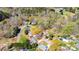 Aerial view showcasing approximate property lines, highlighting the home's wooded lot in a tranquil neighborhood setting at 444 27Th Avenue Nw Cir, Hickory, NC 28601