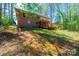 Exterior backyard view of the brick home with a two-level wooden deck at 444 27Th Avenue Nw Cir, Hickory, NC 28601