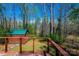 Wooded backyard view from the upper wooden deck, featuring a shed at 444 27Th Avenue Nw Cir, Hickory, NC 28601