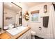 Bathroom features white subway tile, wood-look counter, and neutral walls at 444 27Th Avenue Nw Cir, Hickory, NC 28601