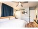 Bright bedroom featuring wood-look floors, white trim, and a sliding barn door at 444 27Th Avenue Nw Cir, Hickory, NC 28601