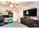 Cozy bedroom featuring soft lighting and a large television for a relaxing atmosphere at 444 27Th Avenue Nw Cir, Hickory, NC 28601
